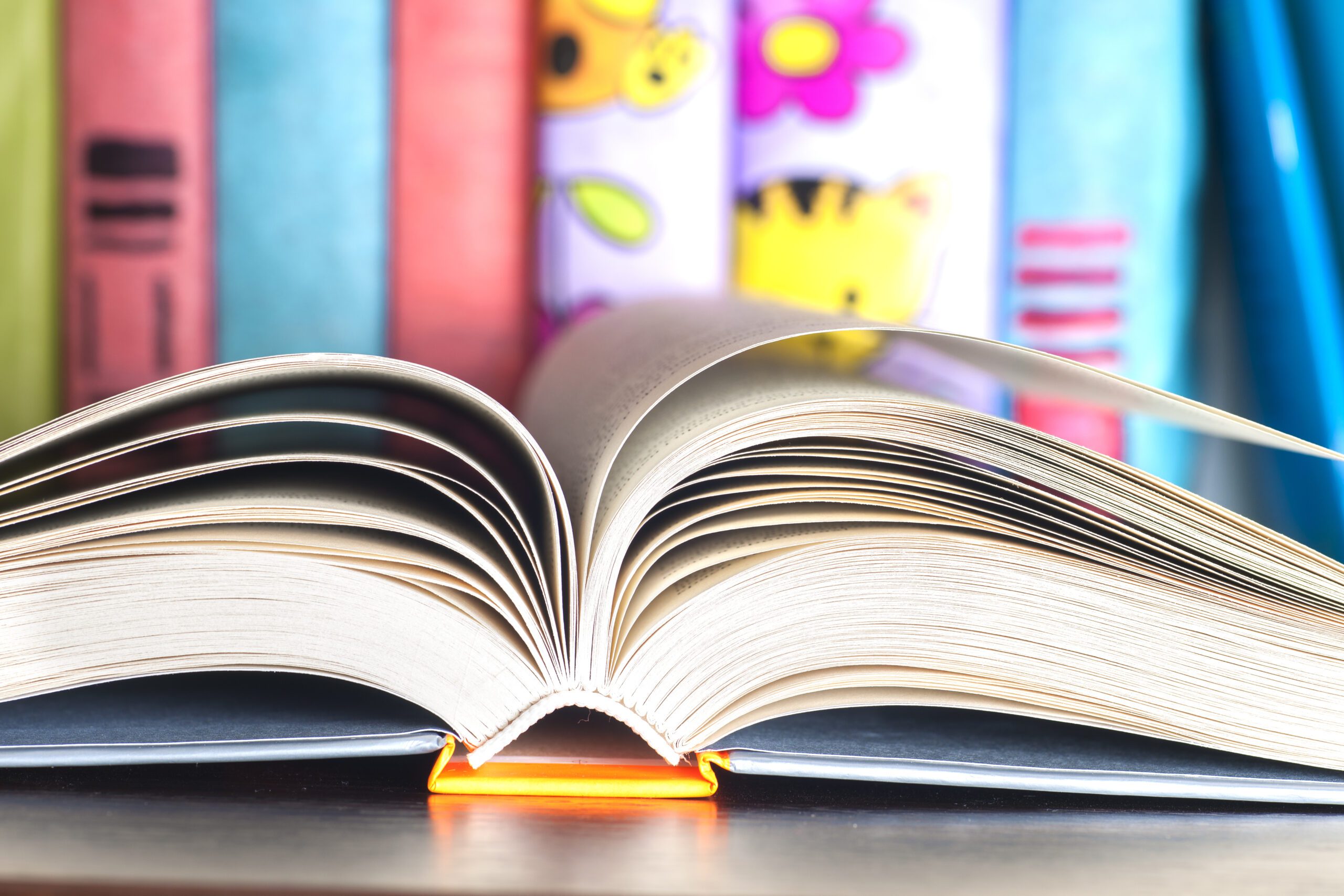 Open book on light table. Back to school. Copy space